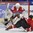 PLYMOUTH, MICHIGAN - APRIL 4: Switzerland's Alina Muller #25 is tripped by Czech Republic's Samantha Kolowratova #5 resulting in a penalty shot while her teammate Klara Peslarova #29 looks on during relegation round action at the 2017 IIHF Ice Hockey Women's World Championship. (Photo by Minas Panagiotakis/HHOF-IIHF Images)